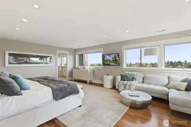 Three bedrooms are upstairs including this incredible primary suite.