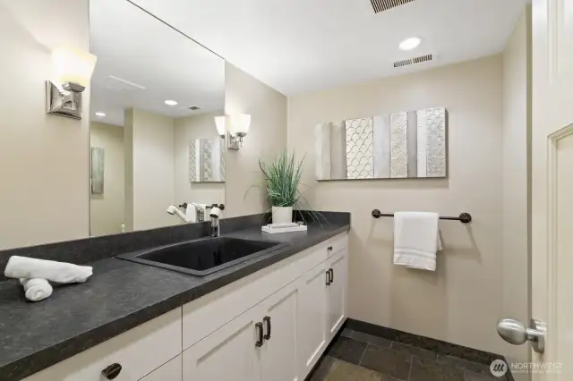 Stylishly appointed 3/4 bathroom on the lower level - perfect to give guests their own space.