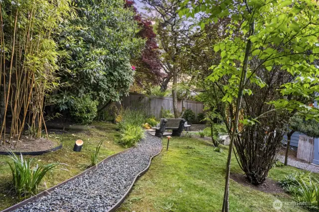 Professionally designed by award-winning landscape architect Christie Coxley, this yard transports you to a zen Japanese garden far away from it all...
