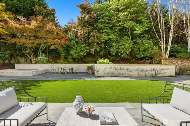 This is looking at the backyard from the French doors outside the dining room.  Notice how the mature landscaping gives you total privacy while you have great lilght as it is facing west.