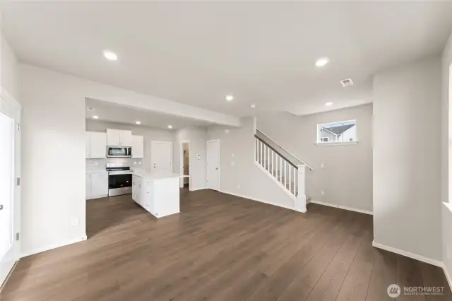 View from the heart of the kitchen into the bright and inviting great room—designed for easy everyday living.  Pictures are for representational purposes only, colors and features may vary.