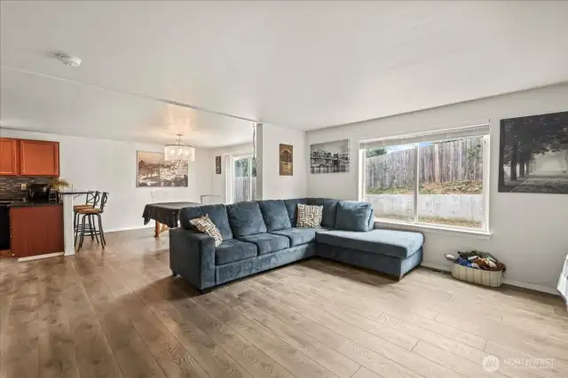 Lot's Of Natural Lighting From The Large Living Room Window and Sliding Glass Door.