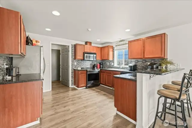 Beautiful Cabinetry, Counters and Backsplash.