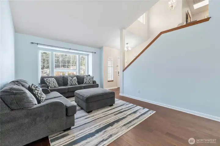 This space has vaulted ceilings and is much larger than it looks. Front and back windows bring in plenty of natural light.