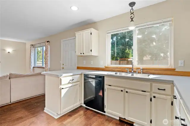 Window looks out to the backyard with a great view of the outdoor living area.