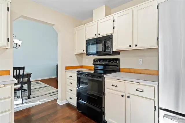 Formal dining area through the open doorway makes serving dinners a breeze.