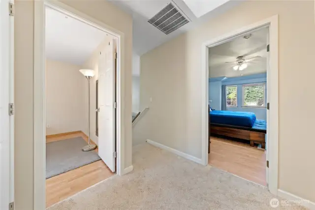 Primary bedroom doorway is located just at the top of the stairs.