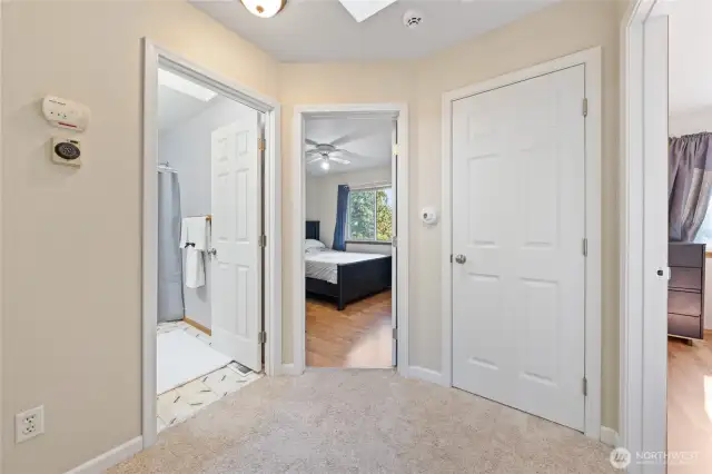 Upstairs hallway leads to guest bedroom #1 on the right, straight ahead is the linen closet and guest bedroom #2, and a full size guest bathroom on the left.