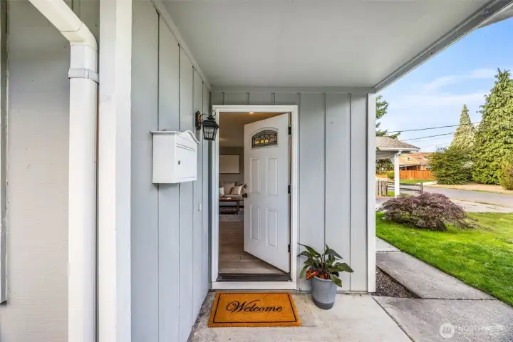 Private, covered entry with a welcoming feel.