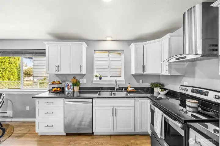 Kitchen offers extensive cabinet storage space.