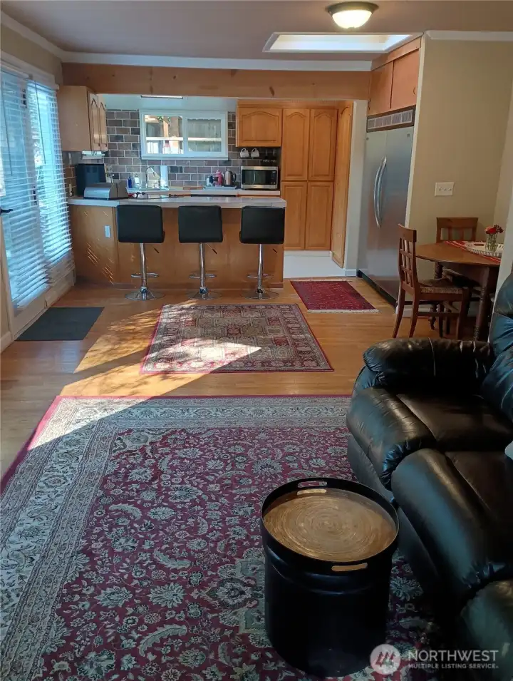 Great room with wood beam and skylight.