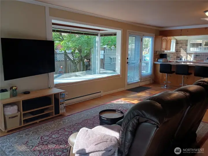 Bay window and french doors leading to backyard.
