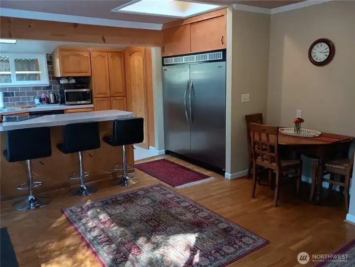 Kitchen with eating area and bar.