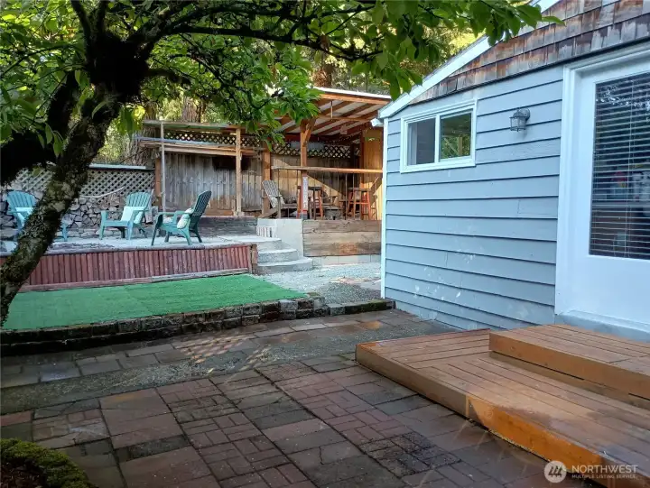 Fire pit and covered seating area.