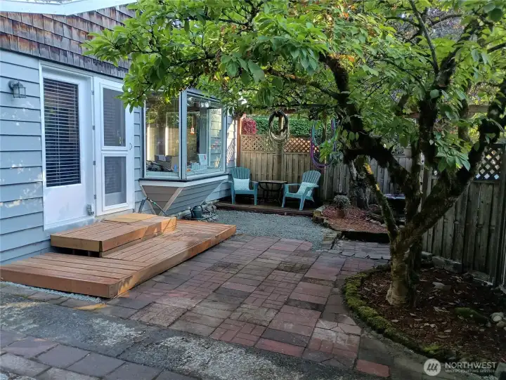 Patio with additional seating and fountain.
