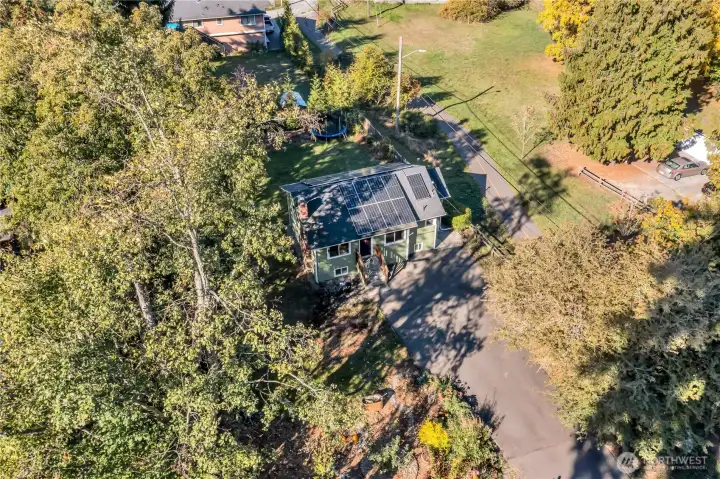 Aerial view showing the long driveway and the pedestrian/bicycle trail along the right side.