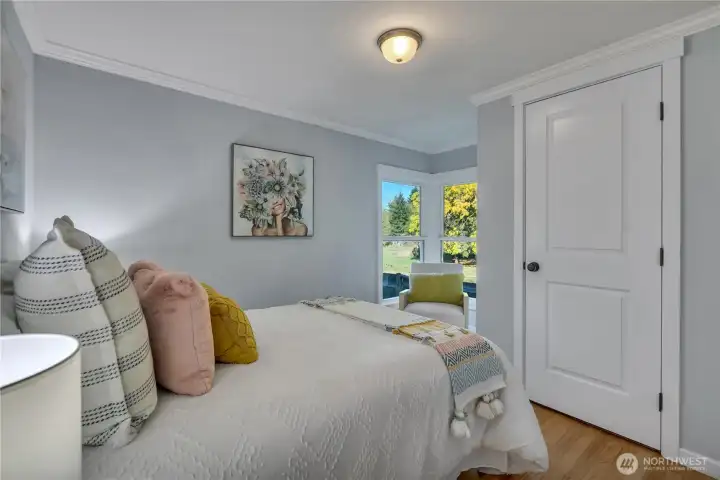 Upstairs bedroom featuring a cozy window nook.