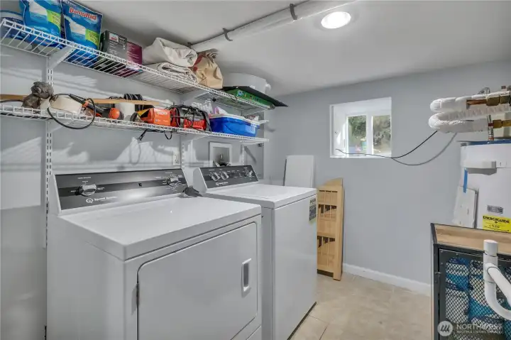 Laundry and utility room with storage.