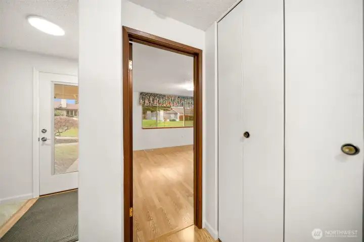 Front entrance to the left and primary bedroom to the right.