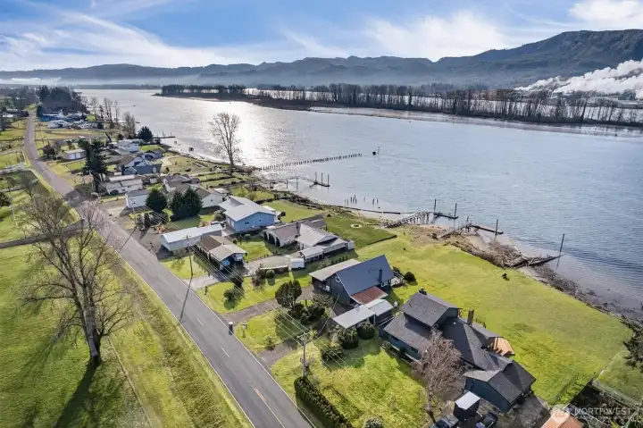 Looking north , upstream towards Portland Oregon. Home is A frame just right of center. As you can see it has large covered RV Parking in front of shed.