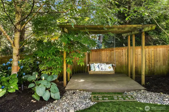 Backyard trellis with swing