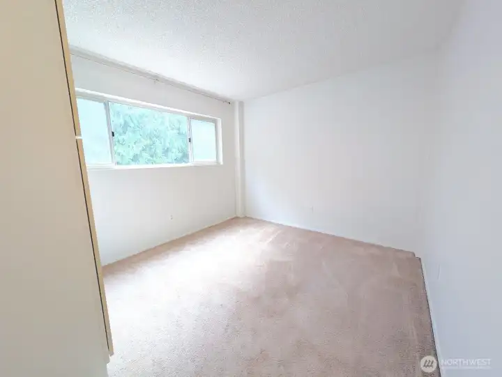 Greenbelt view, extra storage & closet in good sized bedroom.