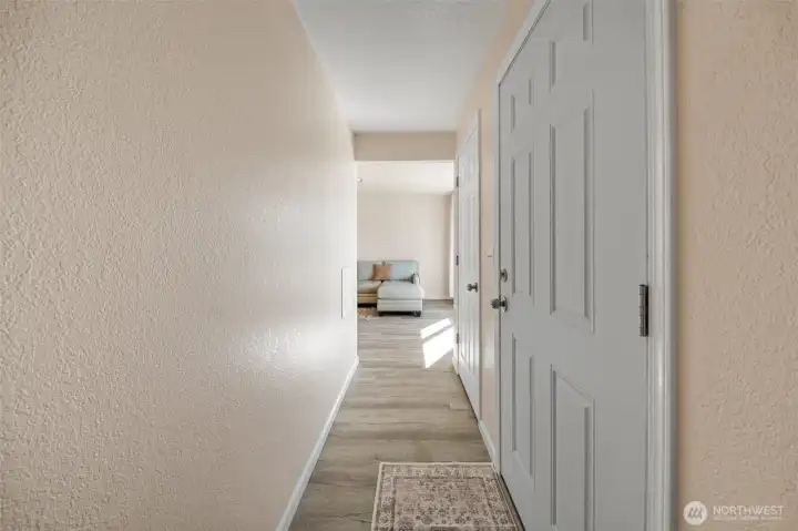 Enter in to hallway with two closets on both sides of the entry.