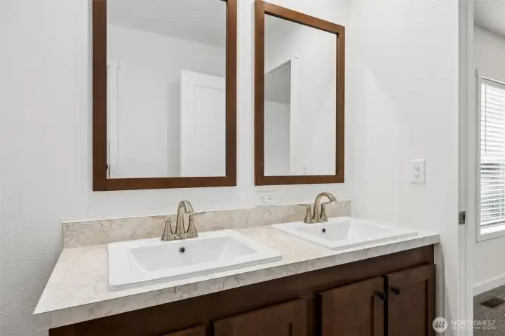 Primary bath with double vanities.