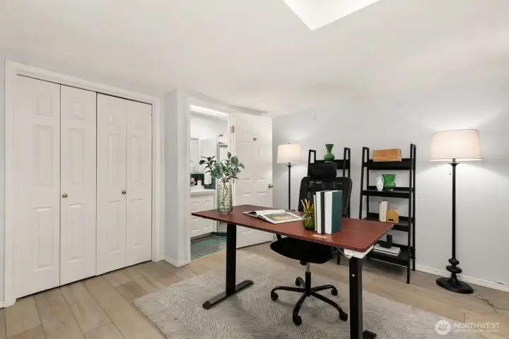 Lower level non conforming bedroom/office. There are laundry hookups inside that closet on the left