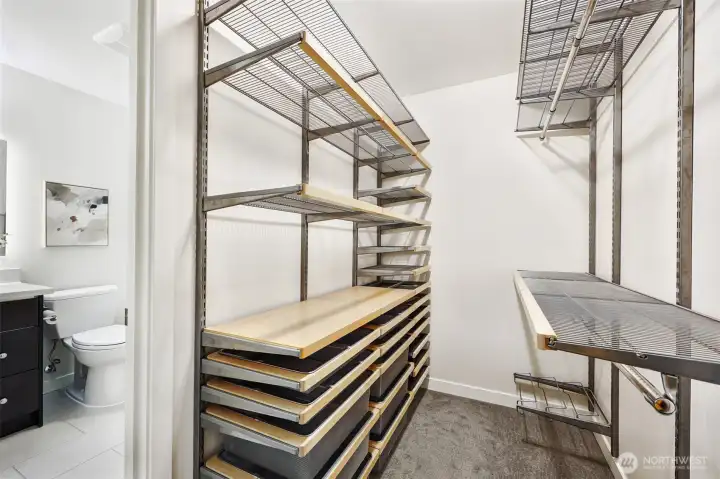 ...the walk-in closet of your dreams! Custom Elfa shelving ensures that everything has its place.