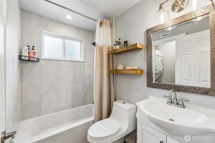 Light and bright bathroom with designer shelving
