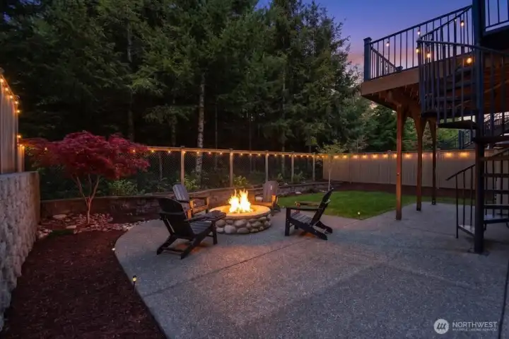 built in fire pit and expanded patio