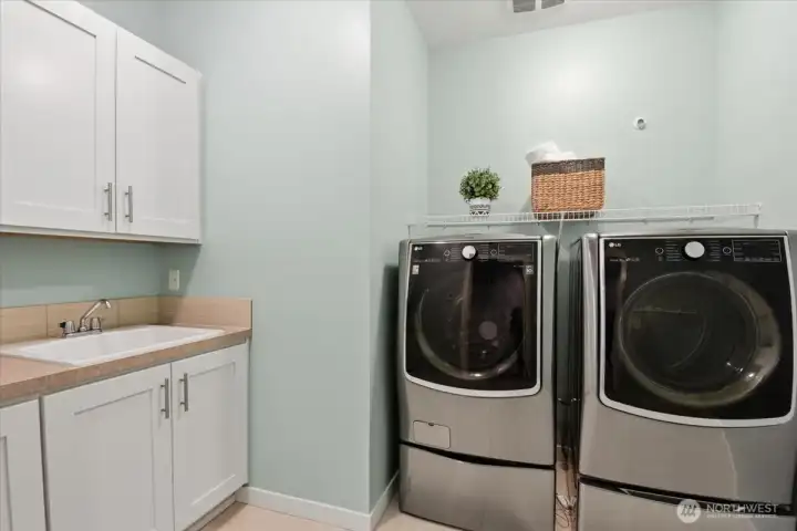 laundry room with sink & barn sliding door for easy access