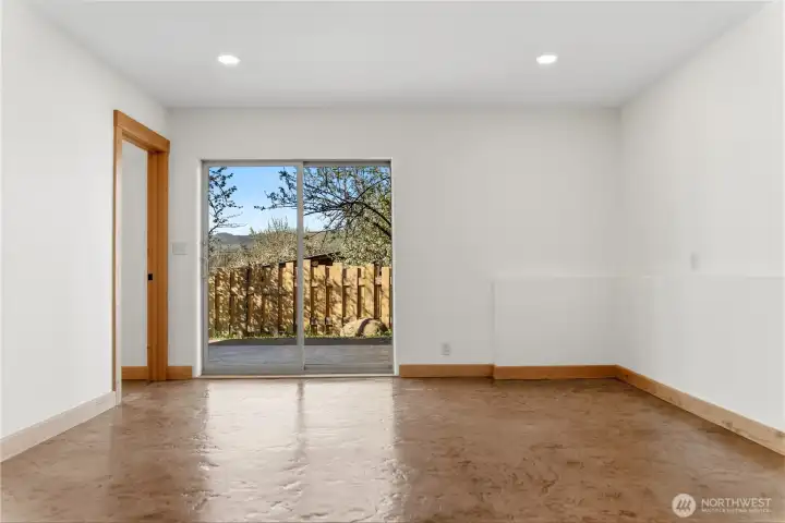 Downstairs living area with sliding doors to outside patio.