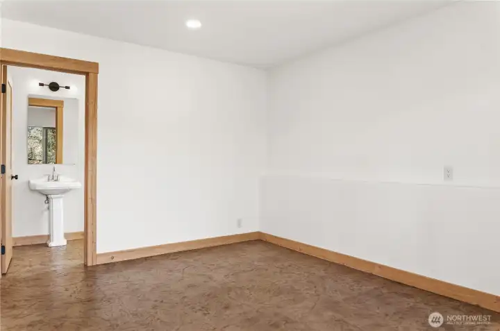 Primary bedroom with sliding doors to patio, closet and private 3/4 bath.