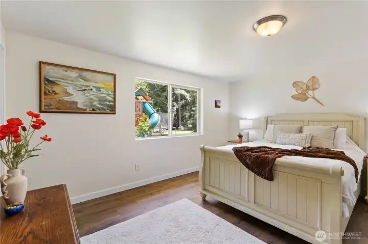 Primary suite is at the rear of the house, with walk in closet and room for a king sized bed.