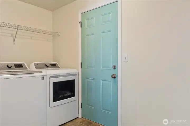 Laundry room with outdoor access.