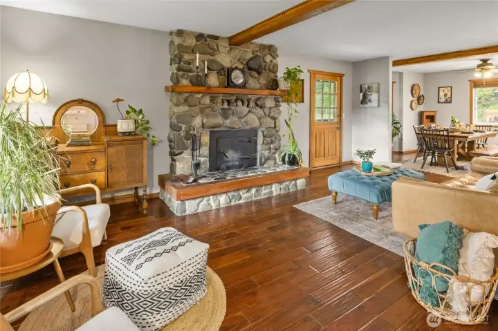 Warm & inviting living room with wood burning stove.