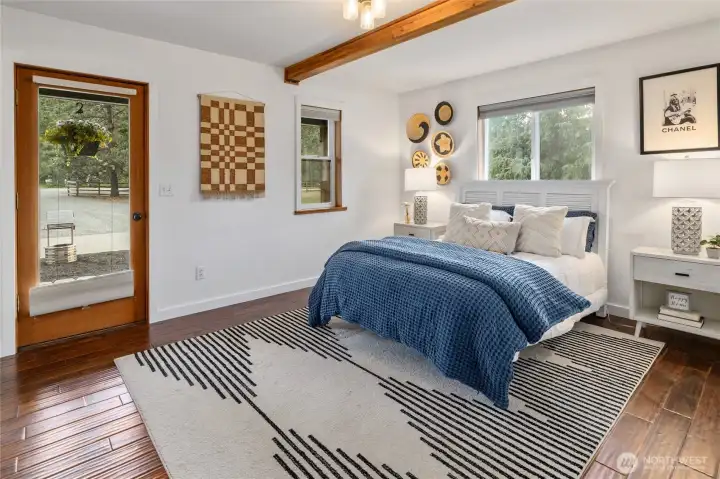 Primary bedroom on main level with exterior access.