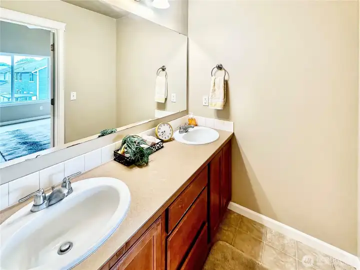 Primary bath with double and separate tub/shower and toilet.