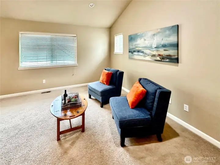 Vaulted family room with great wall space for your large TV.