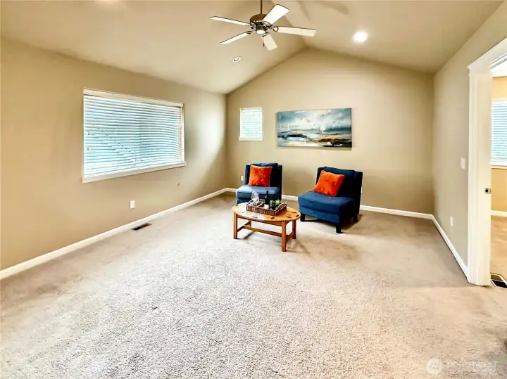 The upper floor family room is perfect area for a movie, play and game room.