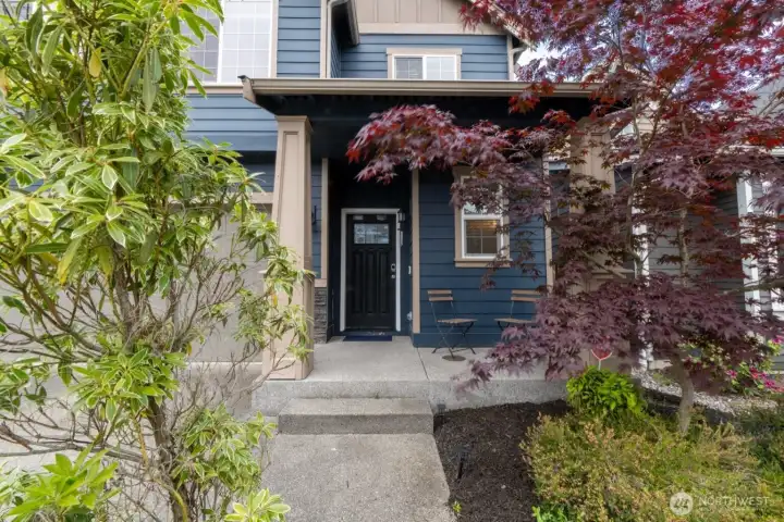 Front exterior showcasing the home’s modern design and inviting entryway.