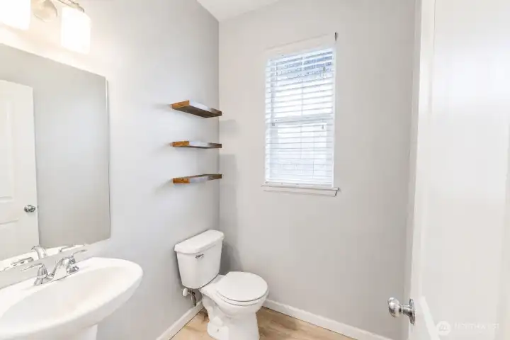 Stylish powder room conveniently located on the main floor.