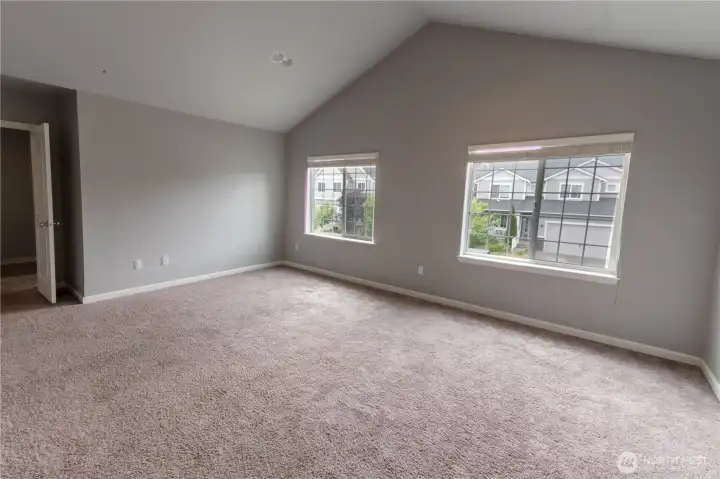 Comfortable primary suite with ample room for a king-sized bed and additional furnishings.