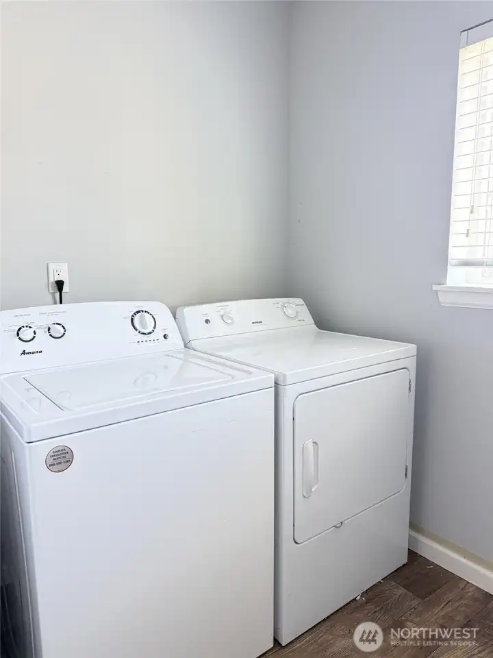 Convenient second-floor laundry room with included washer and dryer