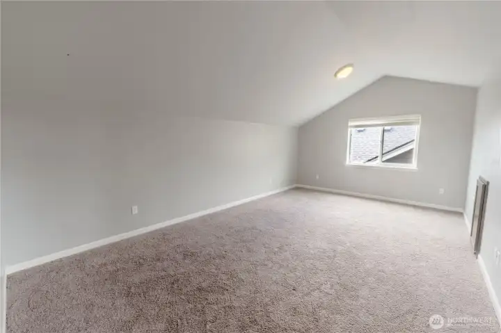 Versatile third-floor loft perfect for a media room, home office, playroom, or fitness space.