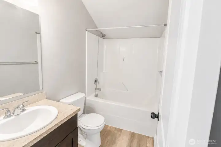 Convenient third-floor bathroom serving the adjacent bedroom and loft area.
