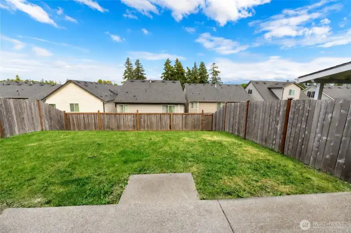 Fully fenced backyard offering space for outdoor entertaining, pets, and play.