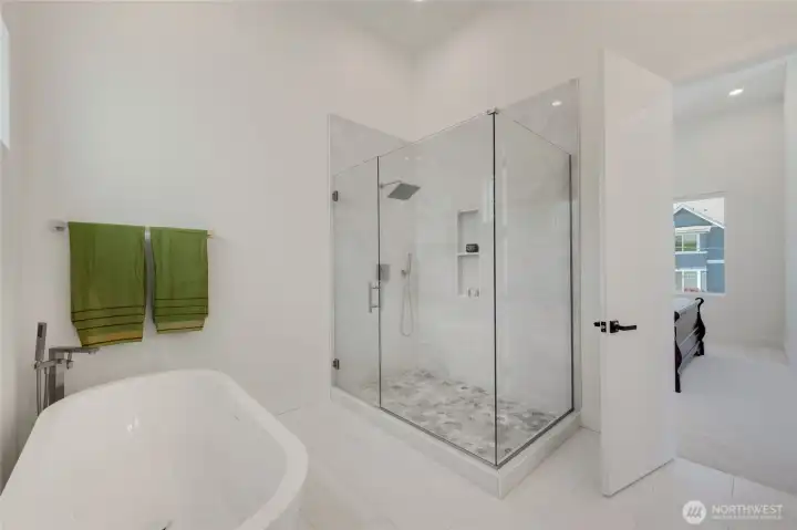 Primary Bath with separate soaking tub and large shower with smart toilet and heated floor Primary Bath with separate soaking tub and large shower with smart toilet and heated floor